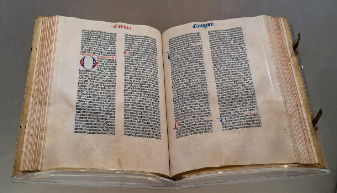 Old books and historical manuscripts on a desk