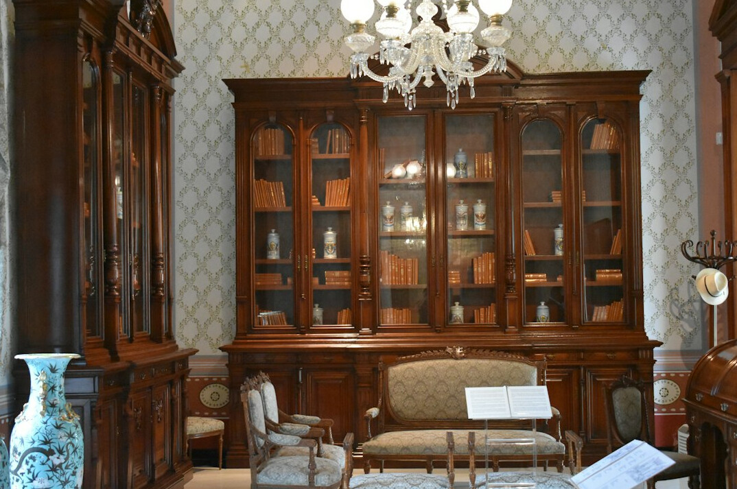 Large traditional library with tall bookshelves